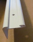 Sample White Aluminum Insert Type Corner Molding 1" Leg X 1/4" RV-16. Fixed Price $5.95.